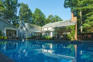 Beautiful Lansing house with pool surrounded by trees