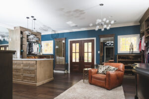 Stylish custom closet with modern lighting and wooden furnishings