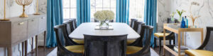 Elegant modern dining room with blue curtains and floral centerpiece