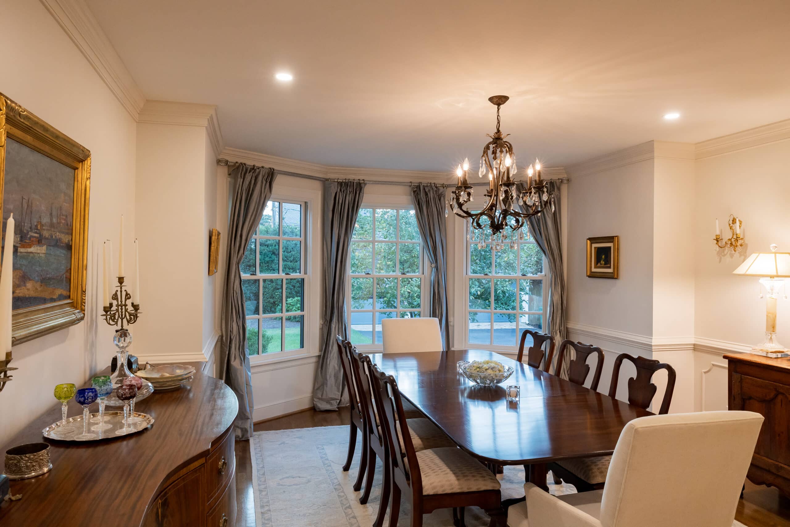Dinning room addition with chandelier and bay window