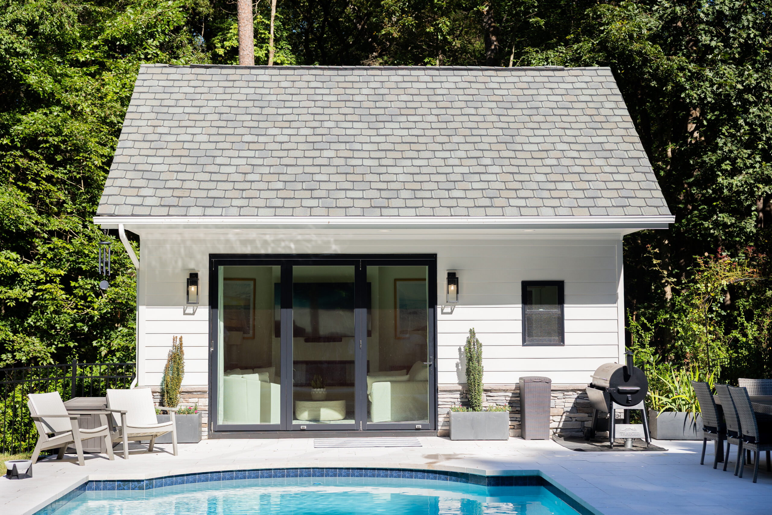 pool house with tri fold doors