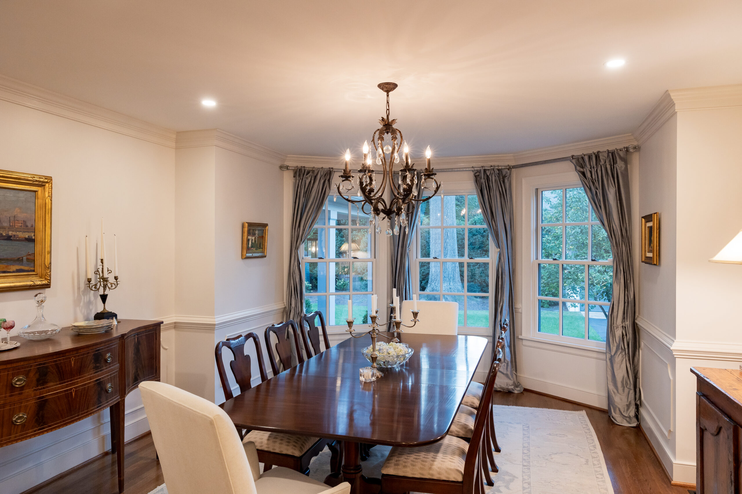 Dinning room addition with chandelier and bay window